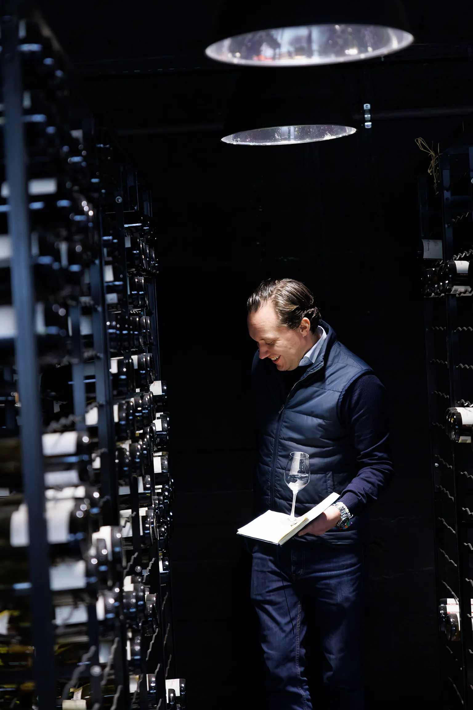 Hemmasommelieren Fredrik Lindfors in a winecellar enjoying a fine selection of Chablis-wines.