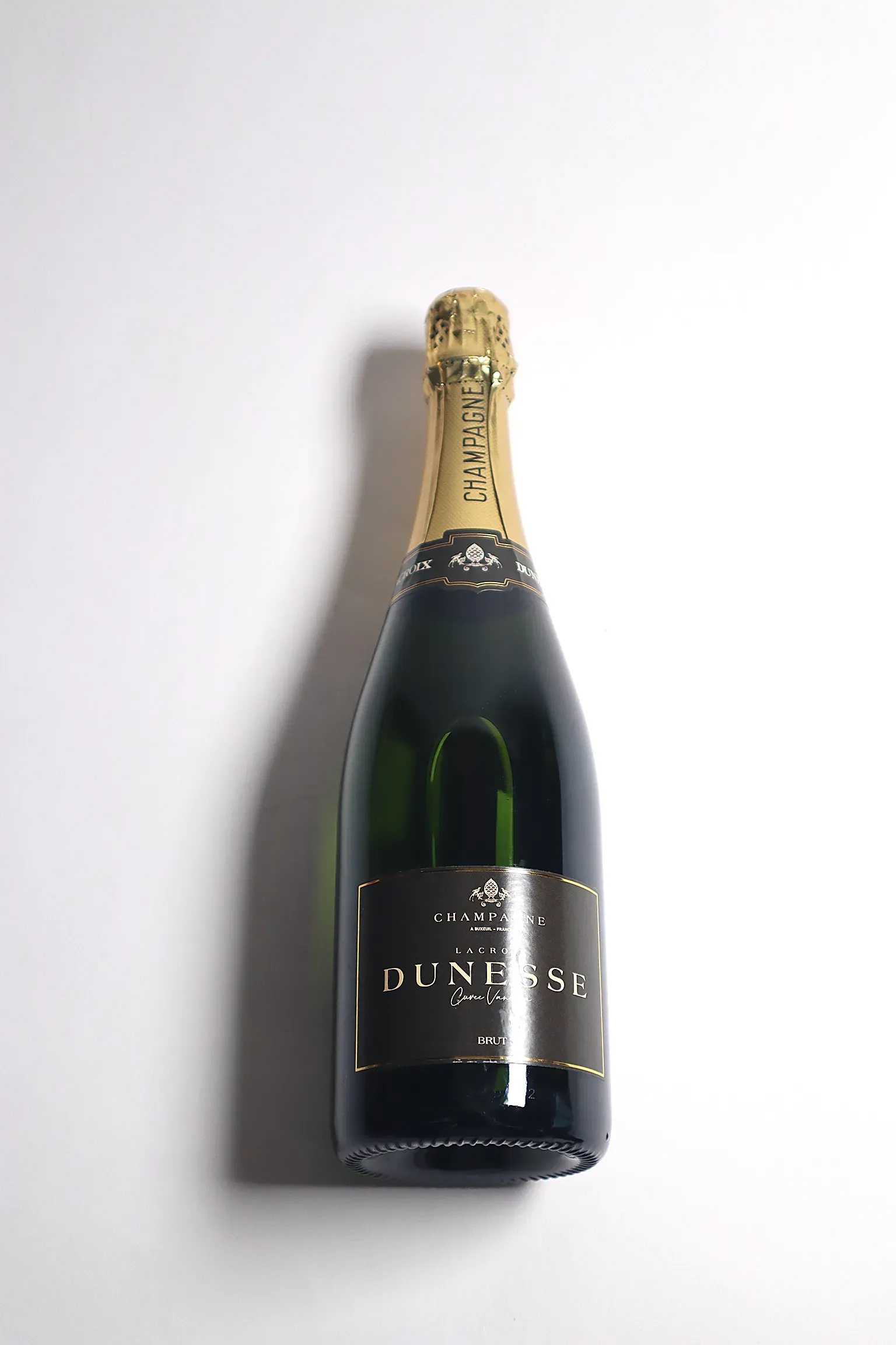 An image with a wine bottle in an artistic light.