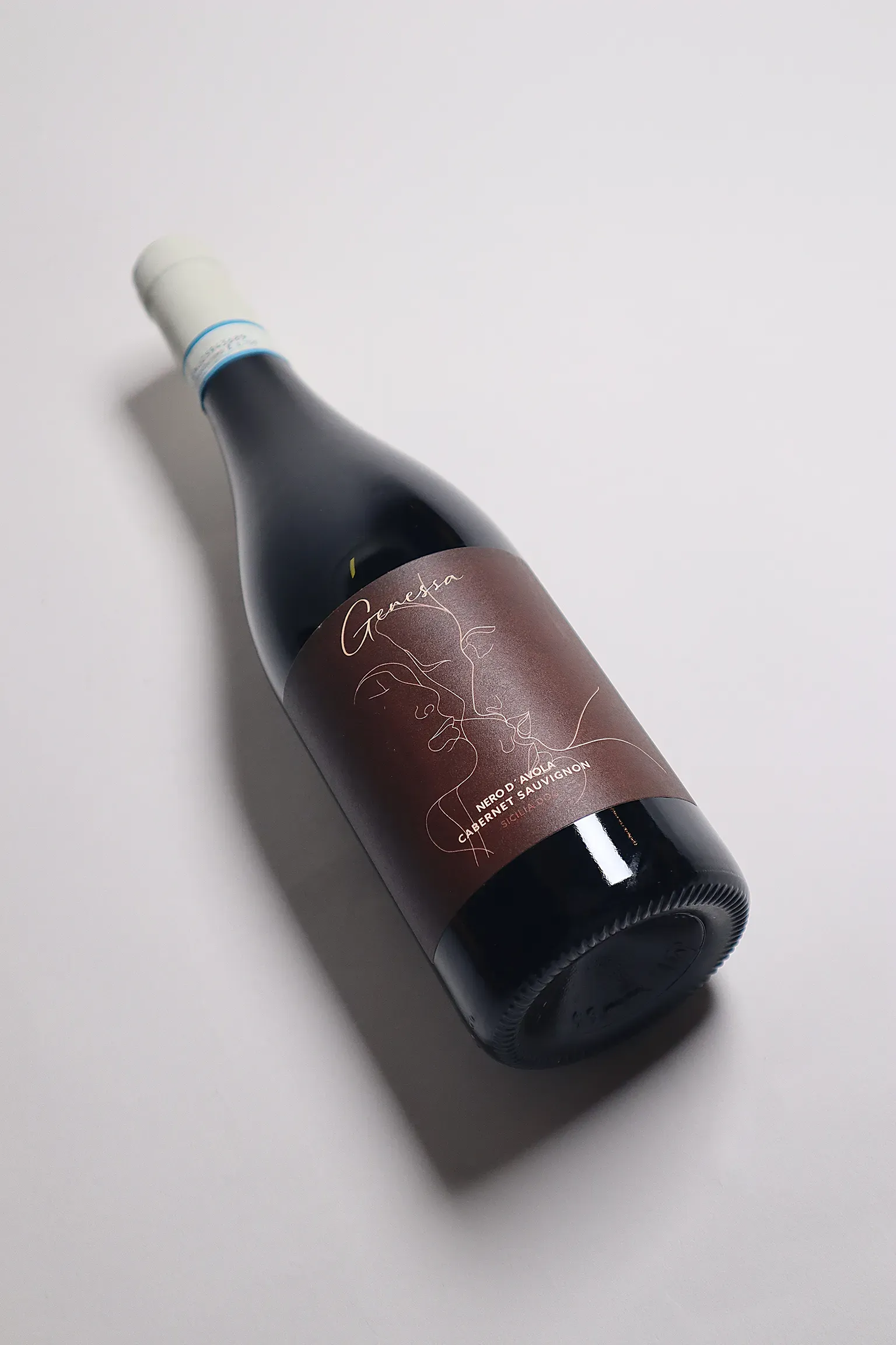 An image with a wine bottle in an artistic light.