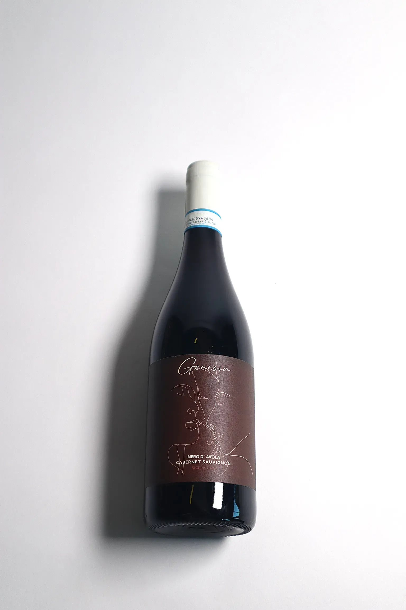 An image with a wine bottle in an artistic light.